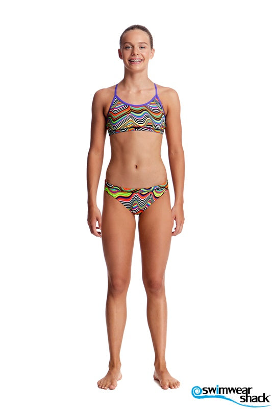 Woman wearing a colorful bikini set with a white background, featuring the brand 'Swimwear Shack'.